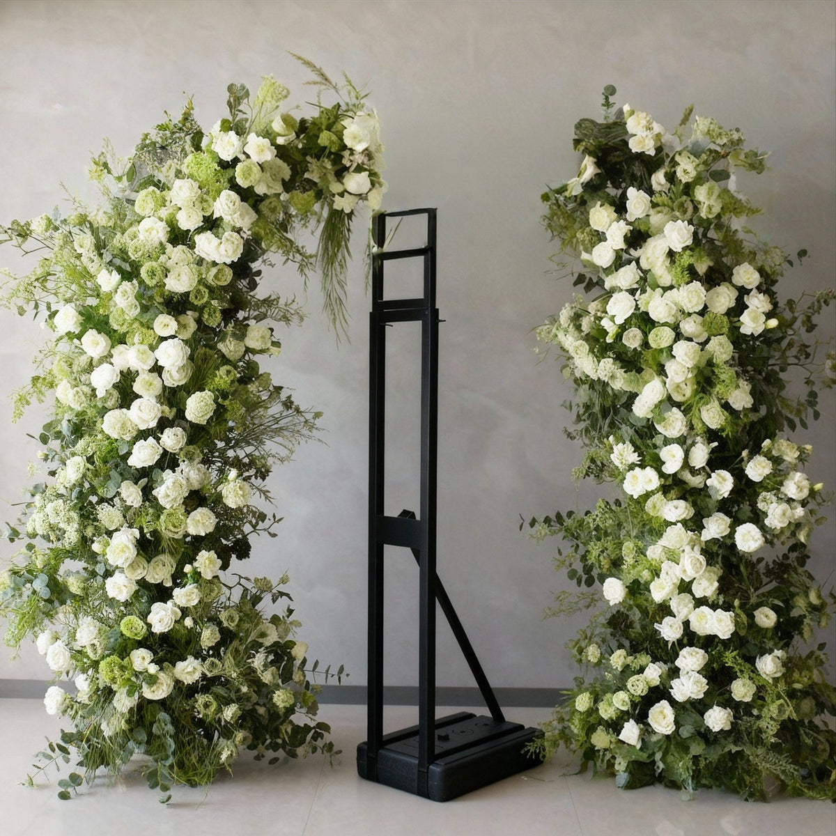 Faux floral columns dressing a hotel event space, designed by Demmerys